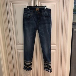 Blue jeans with fun design around ankles